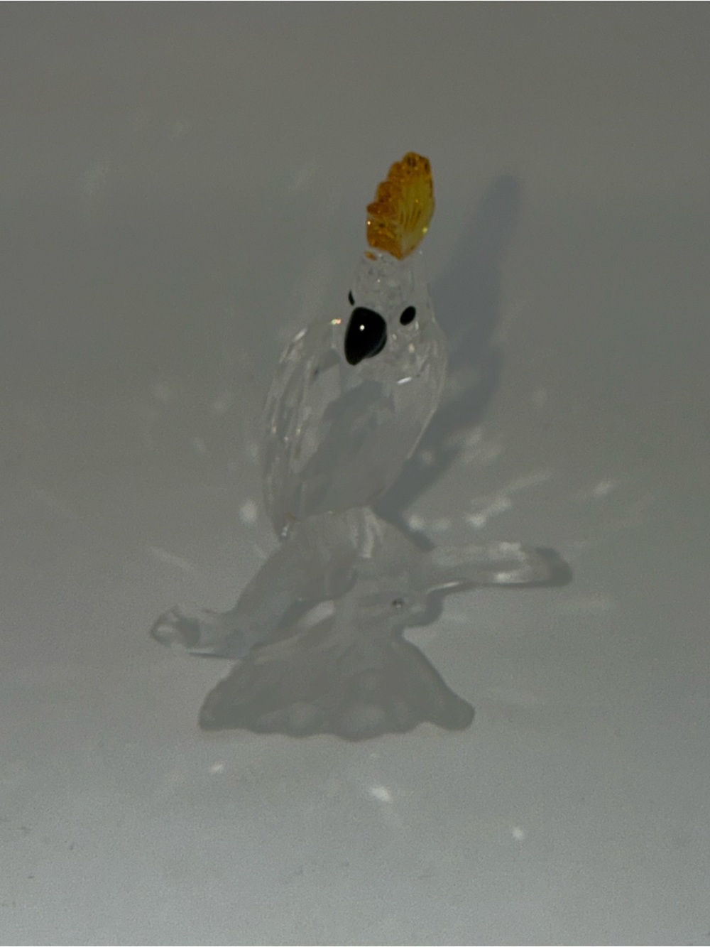 Clear Glass Cockatoo Figurine with Yellow Crest - Decorative Bird on perch